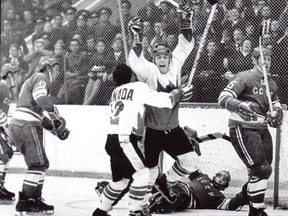 Paul Henderson is embraced by Team Canada teammate Yvan Cournoyer after scoring the winning goal in the 1972 Summit Series. Postmedia Network