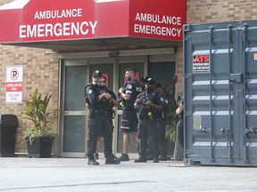 There is a large gathering of police officers at the Emergency entrance at the rear of Sunnybrook hospital. A Toronto Police officer was shot and killed in Peel Region. on Monday September 12, 2022. Jack Boland/Toronto Sun/Postmedia Network