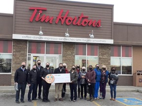 Tim Hortons presents the Airdrie Health Foundation with a $40,000 donation after the success of last year's Smile Cookie Campaign. Local Tim Hortons is supporting AHF once more in 2022, with smile cookie sales starting September 19. Photo courtesy of the Airdrie Health Foundation.