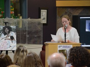 Voice and Vision participant Kelly Lauzon reads one of her pieces next to an art piece at a local artist prepared in response to Lauzon's writing. The Voice and Vision Gala wrapped up local creatives' efforts this year for Alberta Culture Days on September 24.