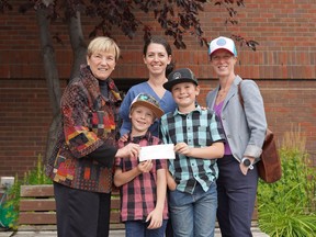 The boys behind Brooks & Co. presented the Foundation with their hard-earned donation on Monday, July 12. 2022. In attendance were the boys, Brooks and Colton, their mother Kim, Barb Shellian, the Director of Rural Health, and Kristen Pauch-Nolin the Executive Director of the Canmore & Area Health Care Foundation. Photo submitted.