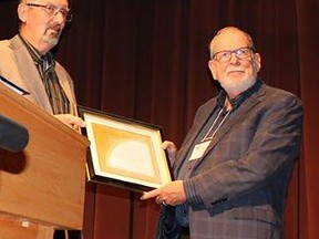 Orland French, right, receives the Hastings County Historical Society Gerry Boyce Award from society vice-president Gary Nicholl. JACK EVANS PHOTO