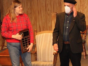 On behalf of the Belleville Theatre Guild, Alexandra Bell presents a Volunteer of the Year Award to Gerry Fraiberg for his work on the theatre's sound and video systems. JACK EVANS PHOTO