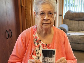 Tyendinaga Mohawks Territory resident Vera Hill holds up a photo of herself at a residential school during her childhood. Hill counts herself fortunate to have not only been a survivor of the schools, but to have had a mostly positive experience during her two years there. (Jan Murphy/Local Journalism Initiative)