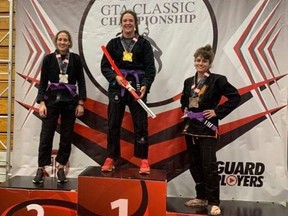 Gold medallist Rain Pfaff of Armstrong Academy of Martial Arts in Chatham, Ont., stands on top of the podium after winning gold at the GTA Classic Brazilian jiu-jitsu tournament in Etobicoke, Ont., on Sunday, Sept. 11, 2022. (Contributed Photo)