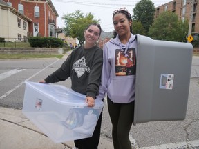 Annalize and Seynette Turner, first-year students at Wilfrid Laurier University – Brantford Campus, both from Innisfil, moved in to their residence Sunday afternoon.  CHRIS ABBOTT