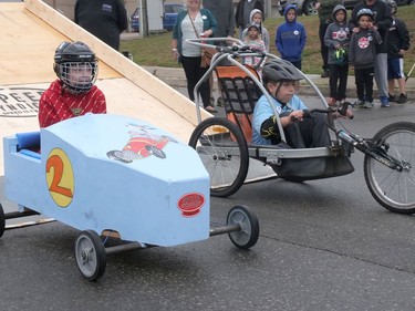 Lucas Barker, left, and Carter Gilchrist race Monday during the Brantford and District Labour Council's 66th annual Soap Box Derby. CHRIS ABBOTT