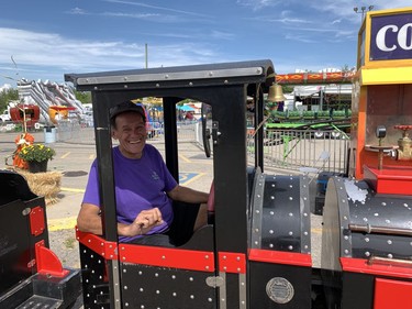 Rob Connelly, secretary of the Showman's League of America, a community of show-people, drives a trackless train on the weekend at the Six Nations Fall Fair. He has been involved in carnivals and shows for more than five decades. Susan Gamble