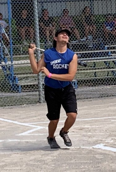 Sandy Porter smacks a fly ball during a friendly softball game between the General and Johnson families on Saturday at the Six Nations Fall Fair. Porter played for the Generals. Susan Gamble