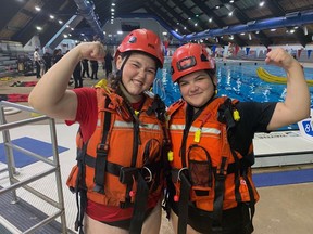 Kayla Drassich (left) and Christina Schrock are participating in Camp Molly, an introduction to firefighting offered for girls by the Brantford fire department. Vincent Ball