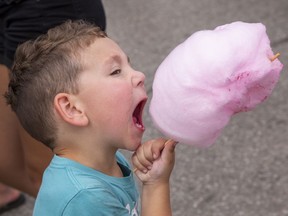 Lucas Hunt, age 3 of St. George gets set to devour some candy floss on Sunday September 18, 2022 during Apple Fest in St. George, Ontario. Brian Thompson/Brantford Expositor/Postmedia Network