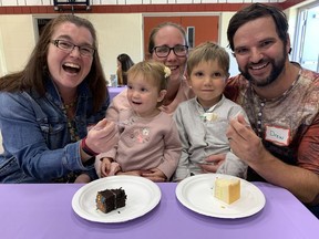 Eighteen-month-old Charlie LaSalle enjoys a taste chocolate cake from midwife Kelly Gascoigne at the Community Midwives of Brantford reunion held at the Brantford Christian School on Saturday. The reunion marked the organization's 24th year and attracted about 150 people. Charlie was there with her mother Melissa, dad Drew Bandy and 31/2-year-old brother,  Jaxson. Both Charlie and Jaxson were delivered by midwives. Vincent Ball