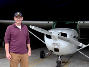 Cameron Wales, of the Brockville Flying Club, poses by the club's plane at the Brockville-1000 Islands Regional Tackaberry Airport on Monday. (RONALD ZAJAC/The Recorder and Times)