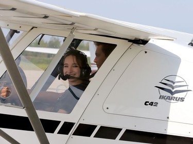 Marissa Massey, left, and Zach Elliott, of the Ontario Advanced Ultralights flight training organization in Kingston, prepare to take off from the Brockville-1000 Islands Regional Tackaberry Airport Sunday morning after taking part in the Brockville Flying Club's annual Fly-In Breakfast. (RONALD ZAJAC/The Recorder and Times)
