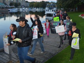 Take Back the Night marchers approach the Women's Memorial Monument on Blockhouse Island in downtown Brockville on Friday, Sept. 16.
Tim Ruhnke/Postmedia Network