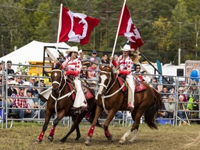 Members of the Canadian Cowgirls precision riding team perform at the International Plowing Match and Rural Expo in Kemptville on Wednesday. The IPM's opening events and welcome ceremonies took place Wednesday, a day later than planned as Tuesday was a Day of Mourning for Queen Elizabeth II.  ERROL MCGIHON, Postmedia