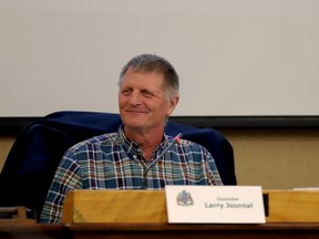 Coun. Larry Journal, chairman of the finance and administration committee, jokes with a fellow committee member at the start of Tuesday's committee meeting.