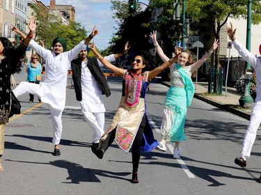 Jasmine Jasani, centre, executive director of the Downtown Brockville BIA, joins in a Bhangra dance on King Street West Saturday morning during Culture Days. The welcome return of the celebration of local arts and culture drew plenty of people on a sunny day. (RONALD ZAJAC/The Recorder and Times)