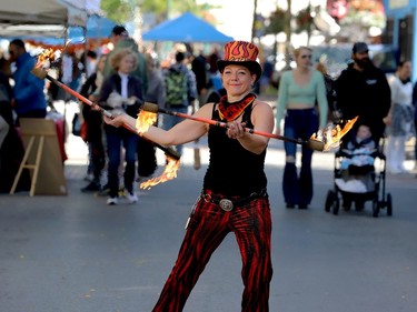 Kristy Flames performs her fire-juggling act as the crowd takes in Culture Days on King Street West Saturday morning. (RONALD ZAJAC/The Recorder and Times)