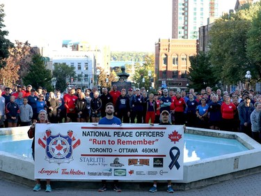 Participants in the National Peace Officers' Memorial Run, or 'Run to Remember,' pose for an aerial photo on the Court House Green on Friday afternoon. (RONALD ZAJAC/The Recorder and Times