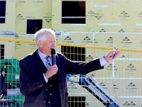 Bruce Hynes, chairman of the Marguerita Residence Corporation, speaks at a topping-off event at the St. Vincent Apartments construction site on Thursday morning. (RONALD ZAJAC/The Recorder and Times)