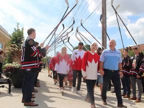 Jackie Stapleton, widow of the late Pat Stapleton, and their son, Mike Stapleton, lead other members of the family by an honour guard of Sarnia Legionnaires players at the beginning of the Sept. 10 ceremony to rename the Sarnia Arena as the Pat Stapleton Arena.
Paul Morden/Postmedia