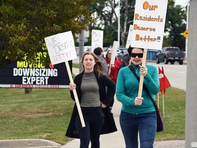 Kennedy Newton (left),  personal support worker at Chatham Retirement Resort, and Autumn Desormeaux-Malm, a nurse at the Keil Drive facility, participate in a rally against cut hours oj Sept. 29. Tom Morrison/Chatham This Week