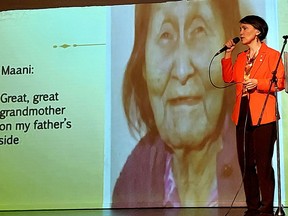 Susan Aglukark sings a song during her NOMAD: Correcting the Narrative presentation held in Chatham on Thursday as an image of her great-great grandmother Maani, who chose her Inuit name Uuliniq, is displayed on a screen. PHOTO Ellwood Shreve/Chatham Daily News