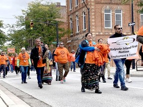 Participants are seen in downtown Wallaceburg taking part in the Healing Walk and Gathering held Thursday ahead of the National Day for Truth and Reconciliation. (Peter Epp/Postmedia Network)