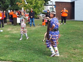 Walpole Island First Nation members Tyara Jacobs, left, and Miley Soney, perform a jingle dress dance during the Healing Walk and Gathering held in Wallaceburg on Thursday. (Ellwood Shreve/Chatham Daily News)