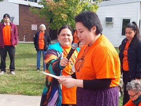 Lindsay Wrightman shares the story of her grandmother and residential school survivor, Jennie Blackbird, to those attending the Healing Walk and Gathering held in Wallaceburg Thursday. (Ellwood Shreve/Chatham Daily News)