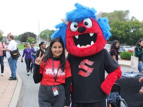 That's Rajat Bajaj, dressed up as the St. Lawrence College mascot for orientation day ceremonies, with student and event volunteer Pooja. Photo on Tuesday, September 6, 2022, in Cornwall, Ont. Todd Hambleton/Cornwall Standard-Freeholder/Postmedia Network