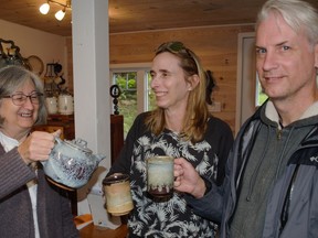 Left, BSM Studio's Brenda Sutton Mader uses one of her pottery pieces with former student Ellen King and her husband, George on Sunday September 25, 2022 in Alexandria, Ont. Greg Peerenboom/Special to the Cornwall Standard-Freeholder/Postmedia Network