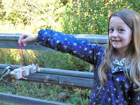 Athena MacDonald was delighted to watch chickadees use her homemade bird feeder she made while attending the Kids Nature Zone event at the Upper Canada Migratory Bird Sanctuary on Saturday September 24, 2022 in Ingleside, Ont. Greg Peerenboom/Special to the Cornwall Standard-Freeholder/Postmedia Network