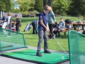 Grade 6 student Lucas Inderbitzin is a picture of concentration, at the driving range during a Stay on Course 4 Communities session Thursday afternoon. Photo on Sept. 29, 2022, in Cornwall, Ont. Todd Hambleton/Cornwall Standard-Freeholder/Postmedia Network