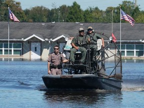 Osceola County sheriffs use a fanboat Friday morning in Kissimmee, Florida, after Hurricane Ian flooding.Getty Images