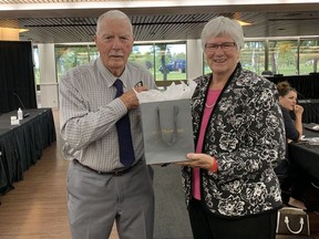 Cornwall Police Services Board chair Coun. Elaine MacDonald, right, presents a gift to outgoing board member William E. Beattie on the occasion of his retirement from the board on Thursday September 1, 2022 in Cornwall, Ont. Hugo Rodrigues/Cornwall Standard-Freeholder/Postmedia Network