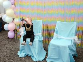 Callum Standring enjoys his trophy as he awaits a photograph during the Stormont County Fair's baby contest held on Sunday September 4, 2022 in Newington, Ont. Greg Peerenboom/Special to the Cornwall Standard-Freeholder/Postmedia Network