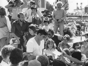 Christopher Reeve signs autographs for young fans on the downtown High River set of Superman III, 1982. PHOTO COURTESY OF THE MUSEUM OF THE HIGHWOOD