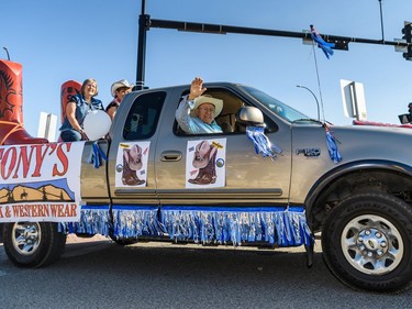 Parade marshal Tony Elain waves at the labour day parade in Cochrane on Monday, Sept. 5, 2022.