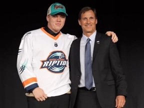 Tyler Davis, left, of Wallaceburg, Ont., is greeted by National Lacrosse League executive vice-president Brian Lemon after being drafted by the New York Riptide in Toronto on Saturday, Sept. 10, 2022. (Contributed Photo)