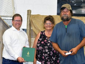 Perth-Wellington MP John Nater made a surprise presentation of Queen's Platinum Jubilee pins to diehard Ag Society volunteers Lisa and Brad Rapien during the opening ceremonies of the 168th Mitchell Fall Fair Sept. 2. ANDY BADER/MITCHELL ADVOCATE