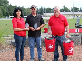 Hanover native John Kennedy, centre, was Hanover Raceway's Top Dash Winning Trainer, and he also received the Ray and Lue Leifso Award for top percentage non-driving trainer. Hanover Raceway's Caity Hillier, left, and Steve Fitzsimmons present him with his awards.
