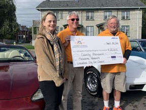 Dr. Tara Baetz accepts a cheque from Limestone City Car Classic organizers David Dick and Brian Beatty outside the University Hospitals Kingston Foundation on Wednesday, September 28.