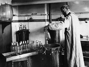 Chemist Louis Pasteur performs an experiment in his fermentation lab in this undated photo.