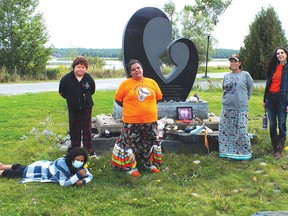 Photo by LESLEY KNIBBS
Shealyn Spanish, R.J. Stoneypoint, Saleena Sutton, Myra Southwind and Elizabeth Cassidy at the monument for residential school children in Spanish.