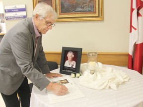 Pembroke Mayor Mike LeMay is the first to sign a book of condolences at Pembroke City Hall in recognition of the passing of her majesty Queen Elizabeth II.