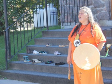 During a Naitonal Day For Truth and Reconciliation event in Pembroke, culture keeper Chantel Chadwick performs the 'travelling song' as marchers prepared to walk through the city from the Isabella St. Lodge to the Pembroke marina. Anthony Dixon