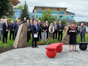 Renfrew County Warden Debbie Robinson reads the proclamation to mark the official opening of the Noojimokamig Garden at the County Administration Building on Aug. 31 as members of Renfrew County Council and County staff look on. County of Renfrew photo