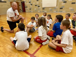 Martin Ritsma instructs a group of young hoopsters during his 37th basketball camp this week at SDSS.